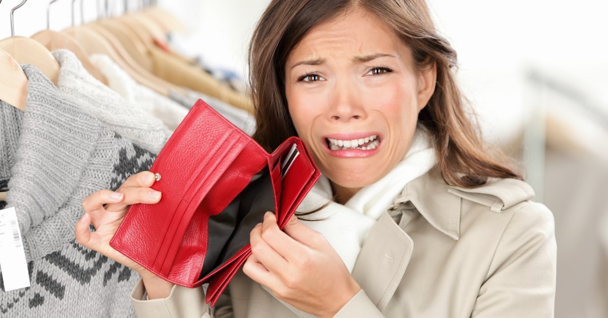 Starting a Credit Freeze Credit Suite - A woman showing her empty red wallet in distress.